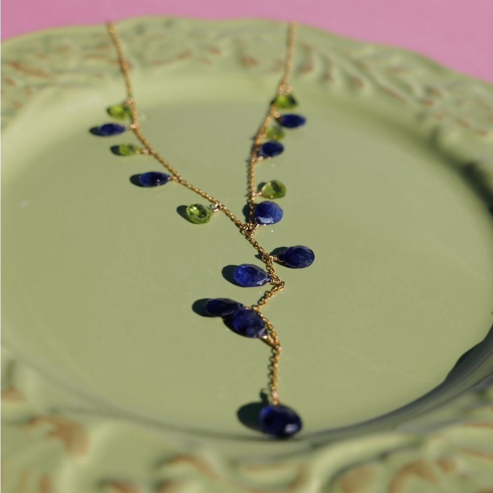 18k gold necklace with blue sapphire and peridot gemstone.